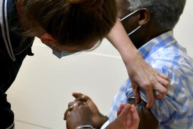 Pathologist Gus Lusack is one of the first to receive the Covid-19 vaccine at NGH last month. Photo: NGH