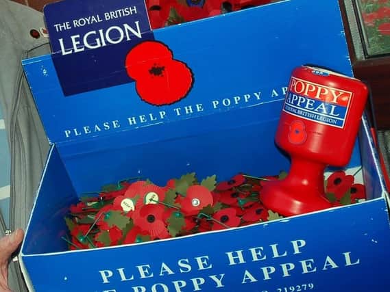 A Poppy Appeal collection box.