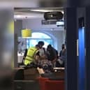 Workers are seen signing-in to claim PPE at the town's Holiday Inn hotel