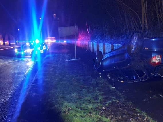 The BMW wound up on its roof in Corby last night. Photos: @NGInterceptors