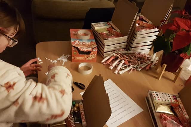 Mae Campbell making her care share boxes