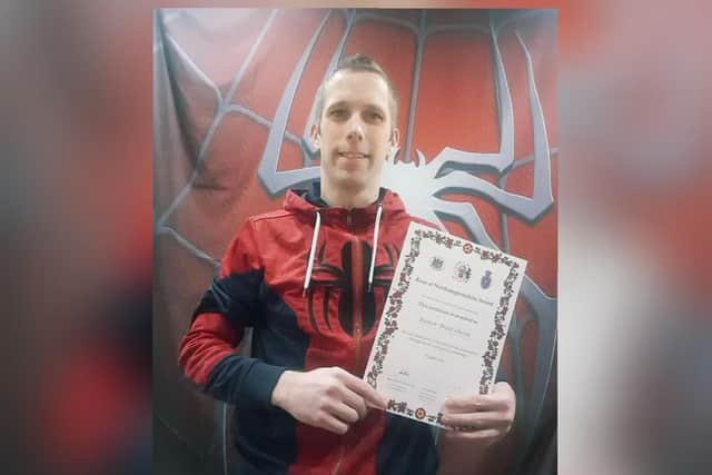 Brett with his award.