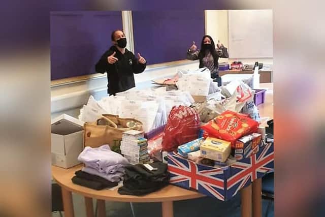 Staff with items ready to deliver.