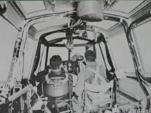 The inside of a Dornier aircraft - with all the airmen sitting in the cockpit