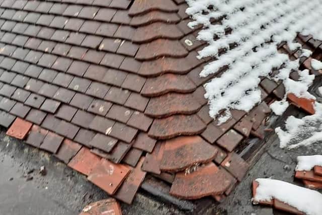 The damaged roof tiles
