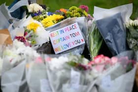 Flowers and tributes near Sir Tom's home at Marston Moretaine today
