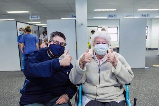 It's a thumbs up from Ruby Moulden (right) after getting her Covid jab at Moulton Park