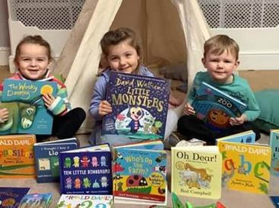 Children with some of the donated books.