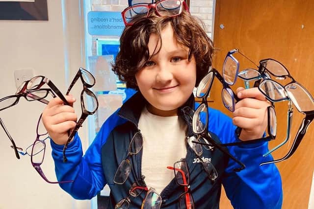 Seth with some of the glasses he collected.
