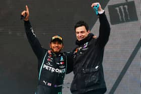 Lewis Hamilton and Toto Wolff celebrate Hamilton's seventh title