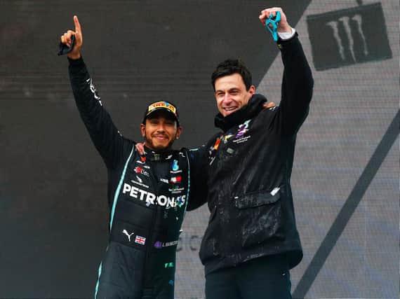 Lewis Hamilton and Toto Wolff celebrate Hamilton's seventh title