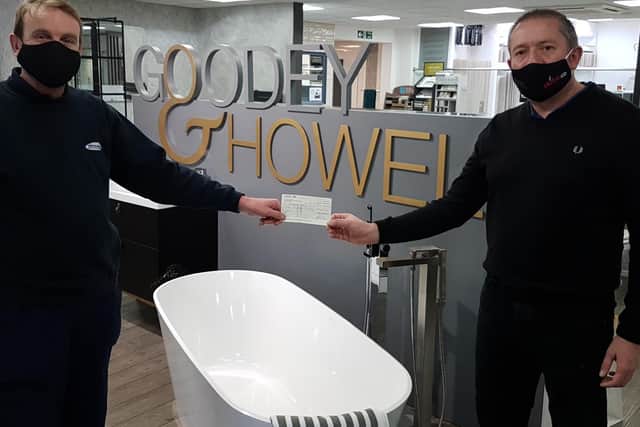 One of the directors Karl Howell (right) presenting Graham Campbell from Glamis Hall for All (left) with the cheque