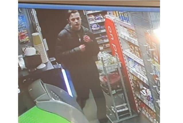 CCTV images have been released of a man police want to speak to in connection with a robbery at a Northampton convenience store.