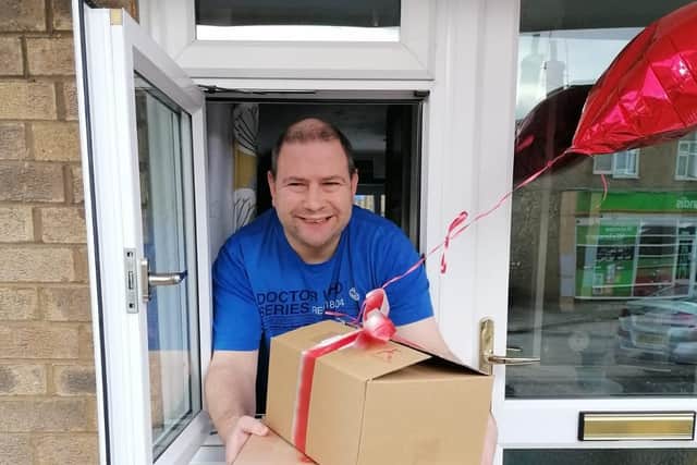 Steven receives his box from Teamwork Trust