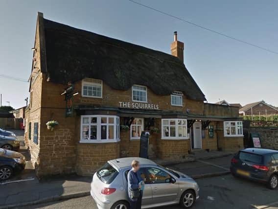 A man burst into the Squirrels Inn in Duston and threatened staff and customers with a hammer. He believed someone there had beaten up his son.