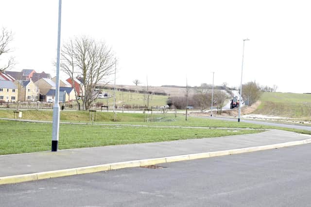 The pavement follows the slip road then makes a 90 degree turn to the main road.