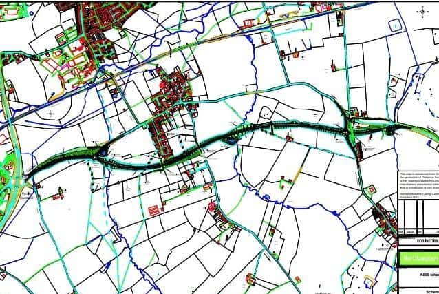 The route of the Isham bypass, highlighted in black. The blue/green area to the left is the A14 Junction 9 roundabout, with Isham being the red area just above the route.
