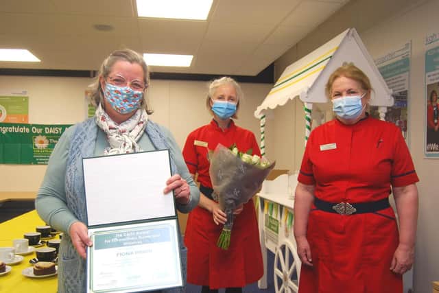 Intensive care unit nurse Fiona Prior receives her award from Director of Nursing and Quality Leanne Hackshall (L) and Deputy Director of Nursing and Quality, Diane Postle (R)