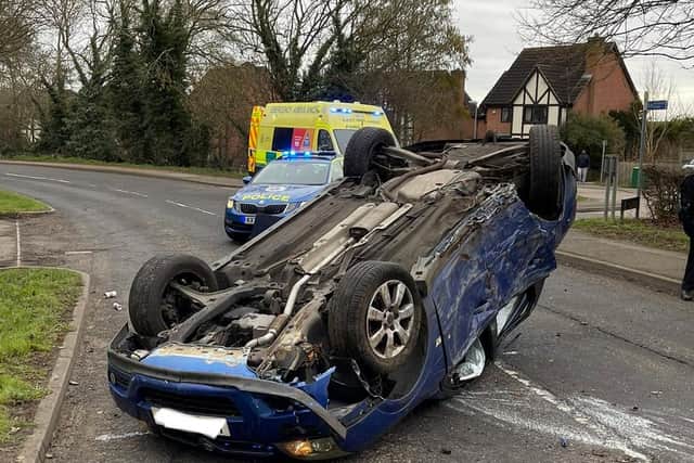 The Vectra wound up on its roof after the smash in Hardwick Road, Wellingborough, early on Saturday morning. Photos: @Northants_RCT