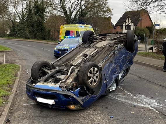 The Vectra wound up on its roof after the smash in Hardwick Road, Wellingborough, early on Saturday morning. Photos: @Northants_RCT