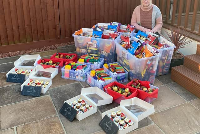 Michelle with the gifts she donated.