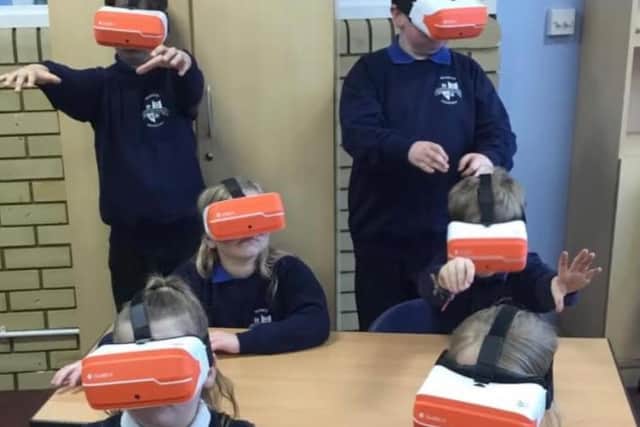 Children from Warwick Primary School experience the VR headsets