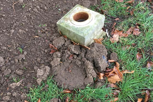 Baby Carol's grave with the mud left by the contractors