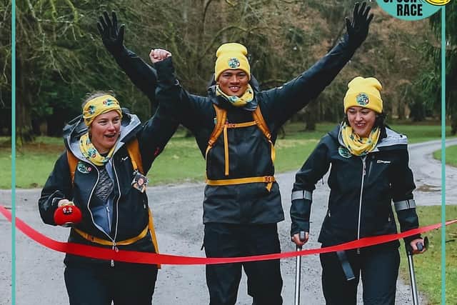 Claire (left) as her team crossed the finishing line.
