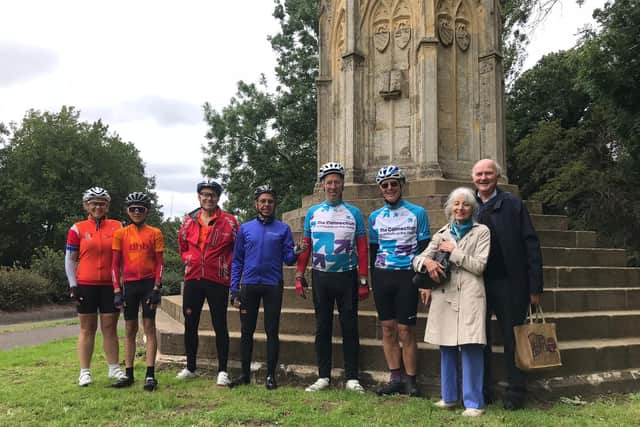 A group of cyclists and supporters at the Queen Eleanor Cross in Northampton during a previous challenge