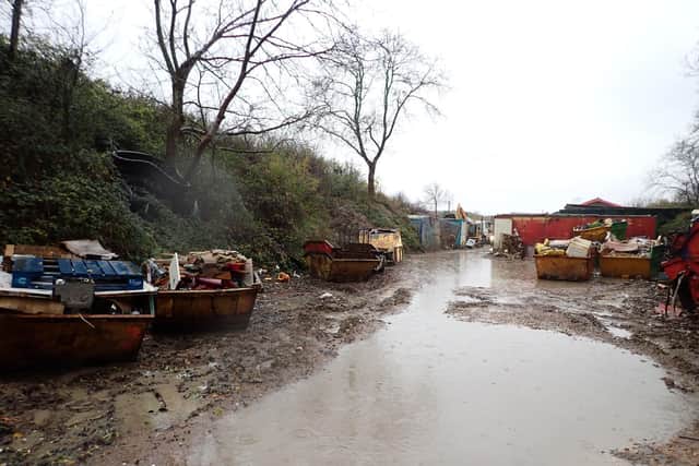 The illegal waste site.