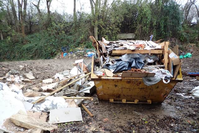 The illegal waste site.