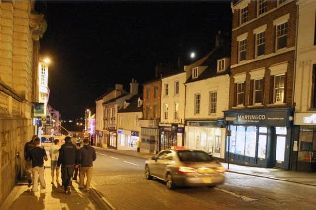 Four young men beat a man unconscious in Northampton town centre in a drunken group attack.