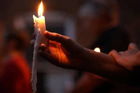 People are being urged to light a candle and stand on their doorsteps at 8pm tonight . Photo: Getty Images
