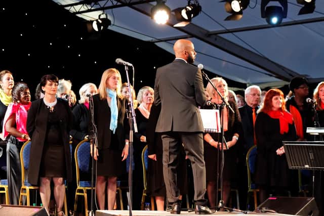 Deep Roots Tall Trees choir perform - library picture