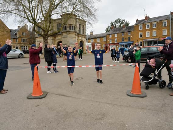 Charlie (left) and Harry (right) finishing the first half-marathon. Picture: Andrew Carpenter