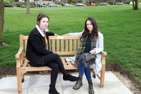 Claire and Lauren Holmes at the bench installed in memory of their big sister. Picture: Alison Bagley Photography.