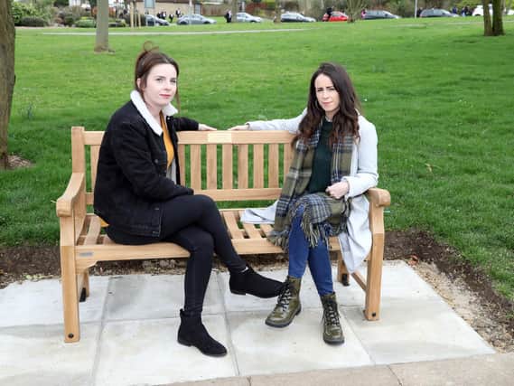 Claire and Lauren Holmes at the bench installed in memory of their big sister. Picture: Alison Bagley Photography.