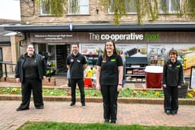 Store Manager Rebecca Wilkinson (front, centre) with colleagues outside the refreshed High Street Central England Co-op store.