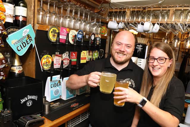 Glad to be back: Landlord John Eames with deputy manager, Lisa Perkins.