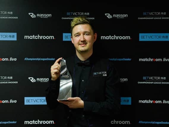 Kyren Wilson shows off the trophy after he won the BetVictor Championship League. Picture courtesy of World Snooker Tour