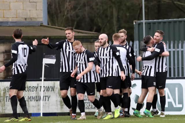The Corby Town players will be looking to return to winning ways under new manager Mark Peters this weekend