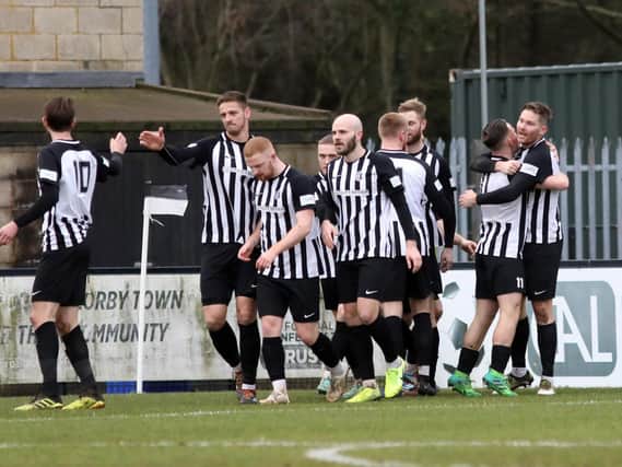 The Corby Town players will be looking to return to winning ways under new manager Mark Peters this weekend