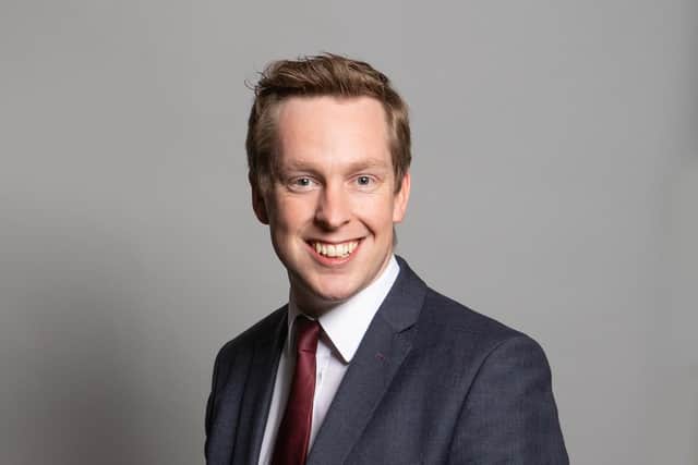 Corby's MP says he will press the Government on a delivery date for the free school that was announced with a fanfare almost three years ago.