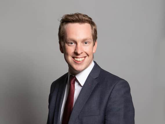 Corby's MP says he will press the Government on a delivery date for the free school that was announced with a fanfare almost three years ago.