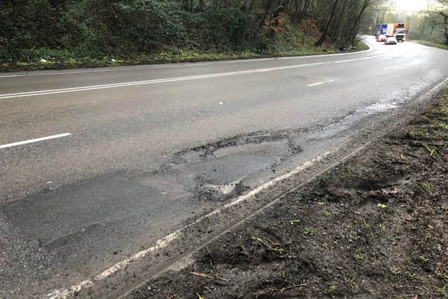 One of the worst patches of road on Rockingham Hill. Several cars have swerved up on to the kerb to avoid hitting it.