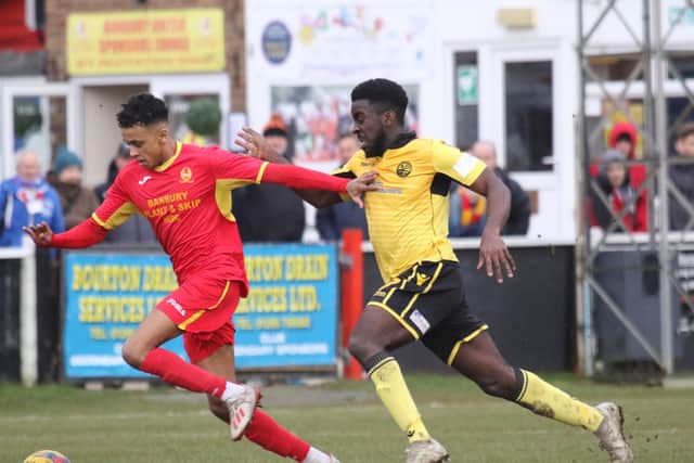 Banbury United's Amer Awadh takes on AFC Rushden & Diamonds' Ben Acquaye