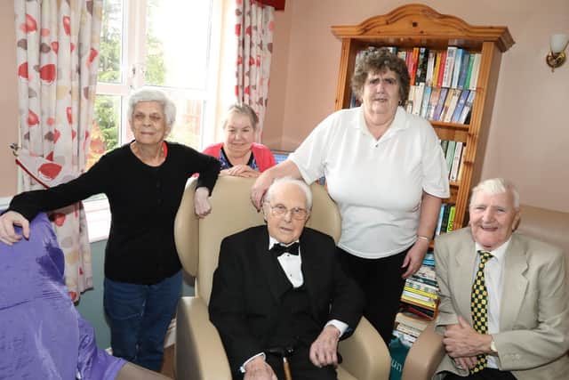 John with his friends who joined him at his Corby home for the celebrations
