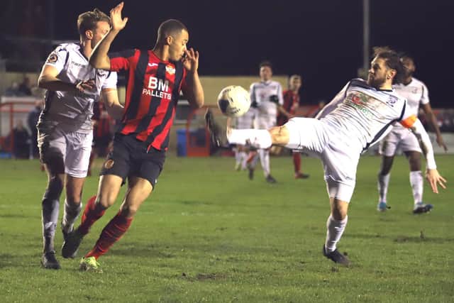 Tre Mitford challenges for the ball with Hereford captain Jared Hodgkiss