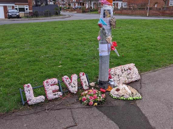 Flowers have been left at the scene in Rushden where Levi Davis was killed