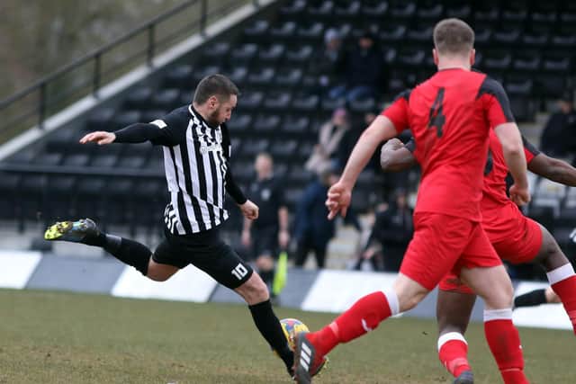 Steve Diggin fires home one of his four goals during Corby Town's 8-1 win over Wantage Town last weekend. Pictures by Alison Bagley